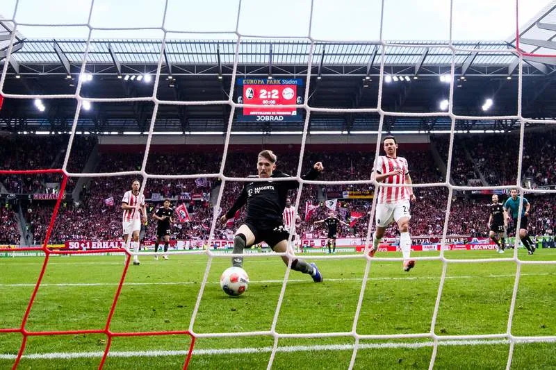 Bayern Munich's Lennart Karl scores his side's third goal during the German Bundesliga soccer match between SC Freiburg and Bayern Munich at Europa-Park Stadium. Tom Weller/dpa