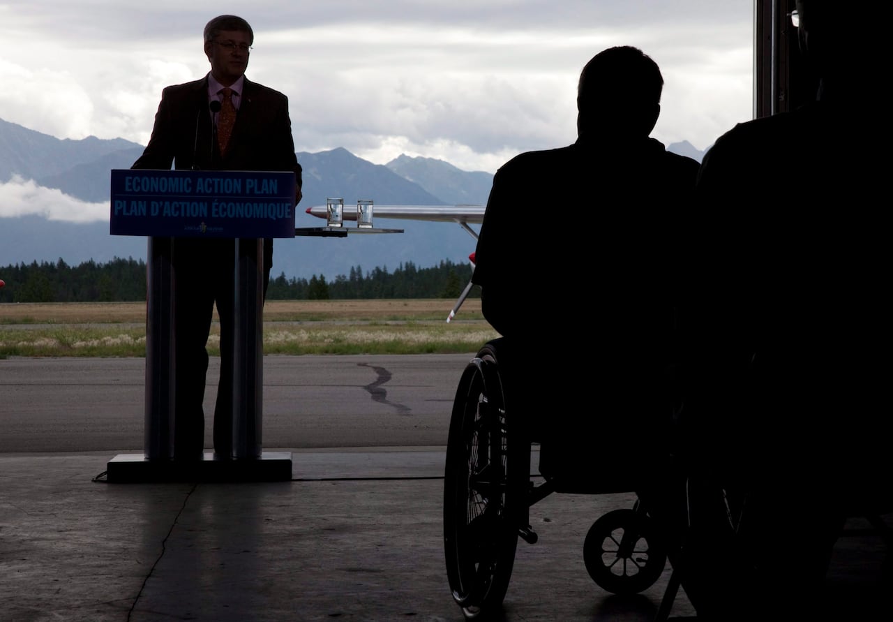 A silhouette of a person in a wheelchair