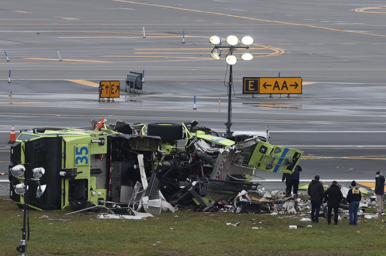 A demolished truck on a runway