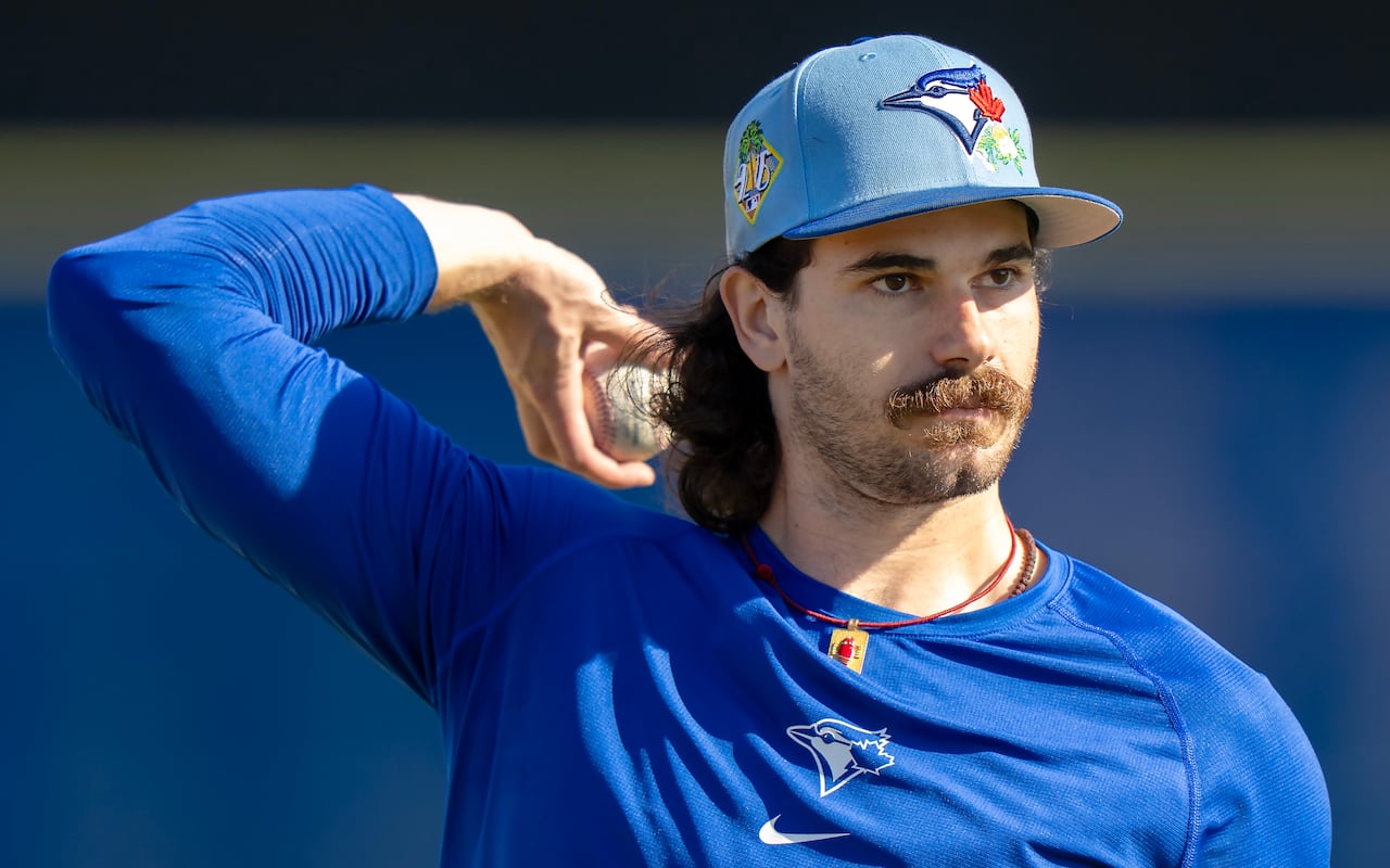 A men's baseball player warms up.