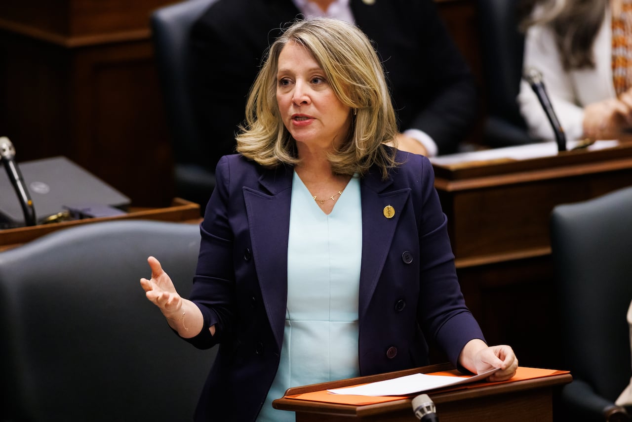 A woman speaks at Queen's Park.