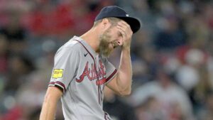Braves ace Chris Sale slams baseball against his head after walking the bases loaded in wild scene