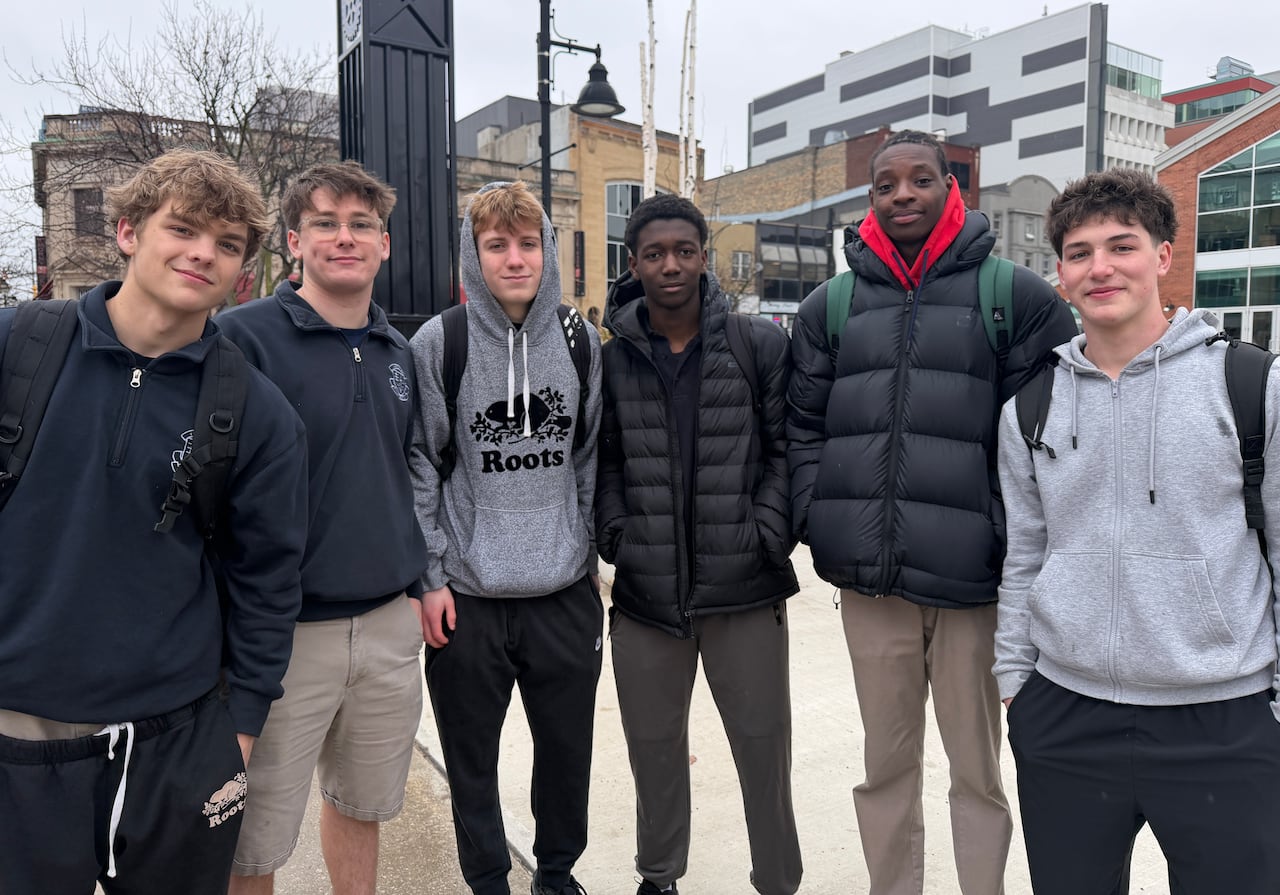 Six high schoolers smile at the camera