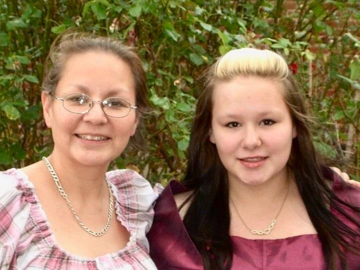 An older and a younger woman are shown.