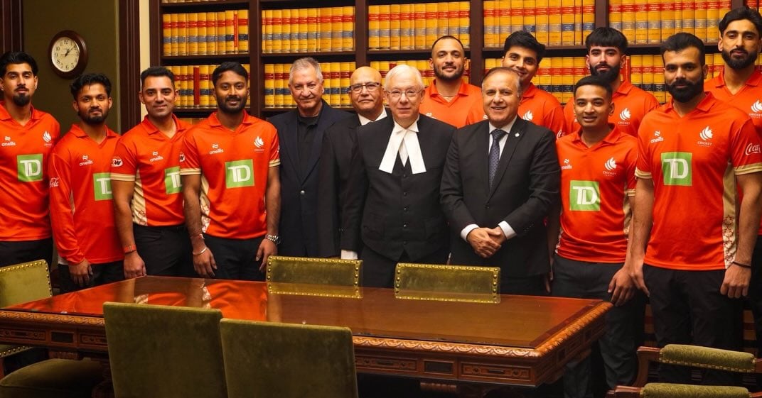 Players with Cricket Canada pose for a photo with federal politicians including Speaker Francis Scarpaleggia and MP Shafqat Ali.