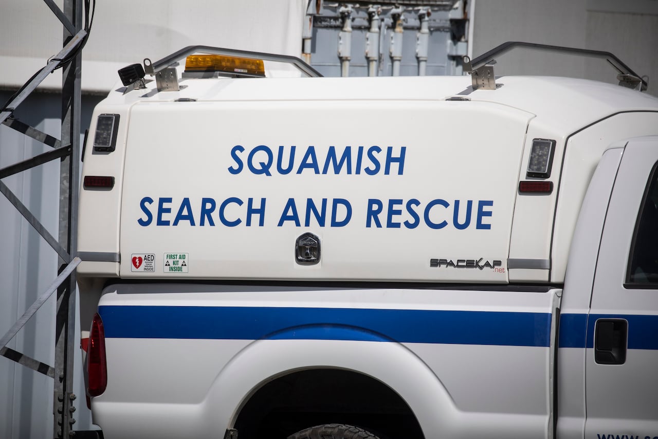 A white truck for search and rescue members is parked. 
