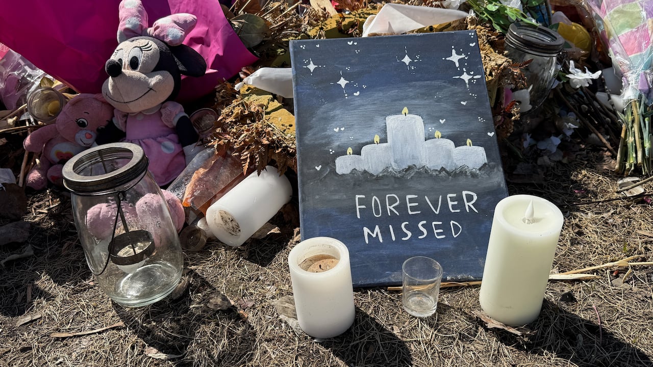 A hand-painted sign placed at the memorial site in Tumbler Ridge for victims of the Feb. 10, 2026 mass shooting.