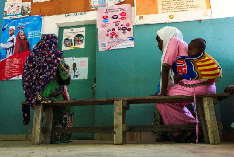 women wait for malaria treatment in cameroon hospital