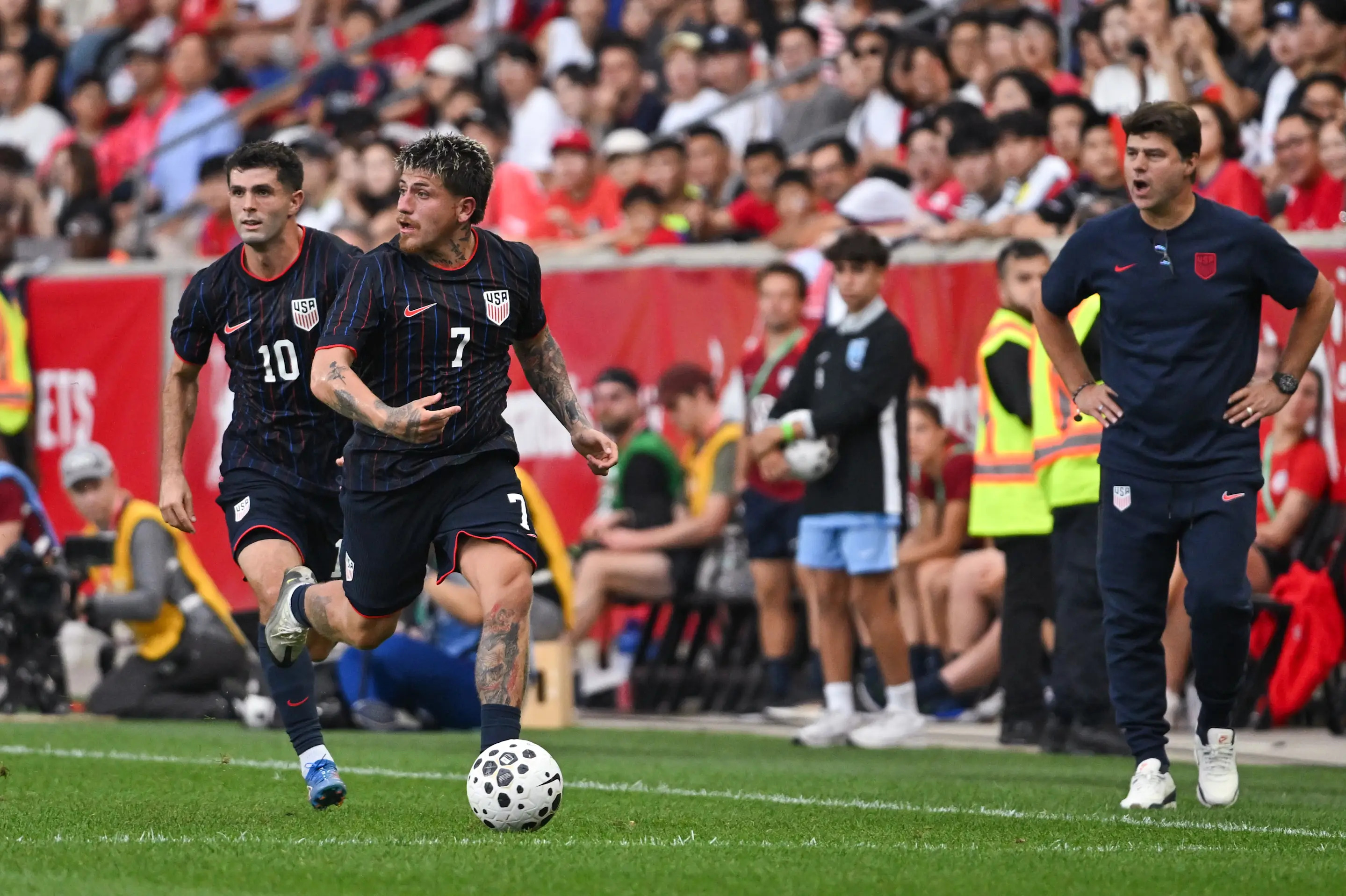 HARRISON, NEW JERSEY - SEPTEMBER 06: Diego Luna #7 of the United States dribbles the ball while United States head coach Mauricio Pochettino yells instructions on the sideline during an International Friendly between the United States and Korea Republic at Sports Illustrated Stadium on September 06, 2025 in Harrison, New Jersey. (Photo by Howard Smith/ISI Photos/USSF/Getty Images)