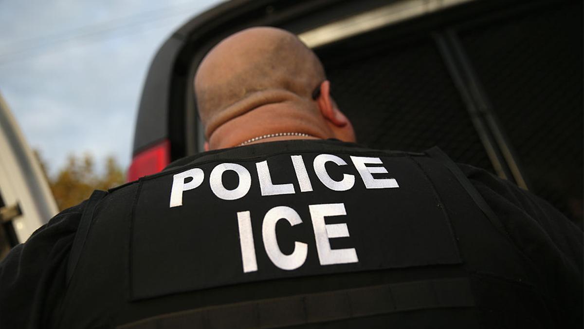 ICE agent detaining an immigrant in Los Angeles, California