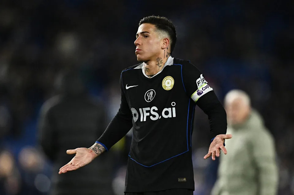 Enzo Fernandez shrugs his shoulders at the away fans after defeat to Brighton (Reuters)