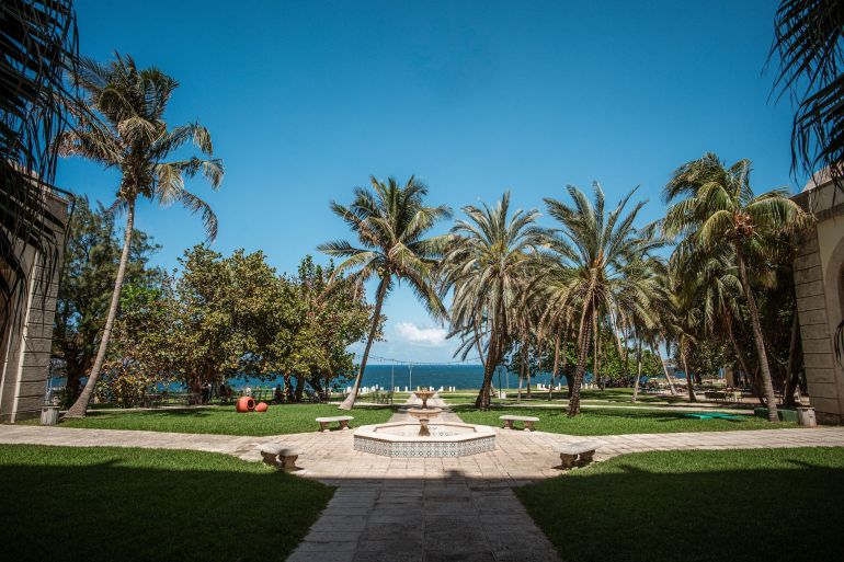 an empty hotel courtyard looking out to the sea in Havana 