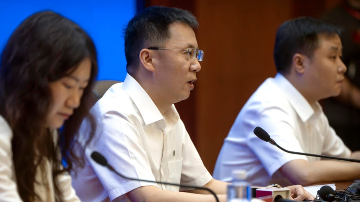 Lin Xiqiang speaking at a press conference at Jiuquan Satellite Launch Center