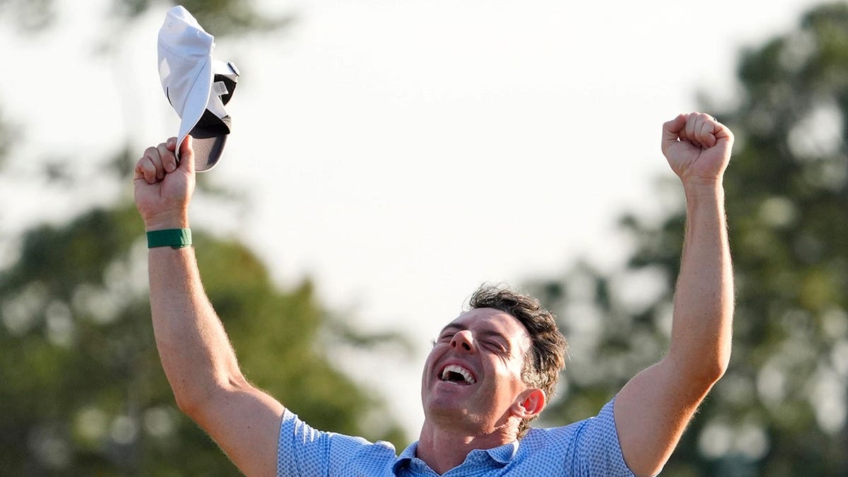 Rory McIlroy celebrating after winning the Masters Tournament at Augusta National Golf Club