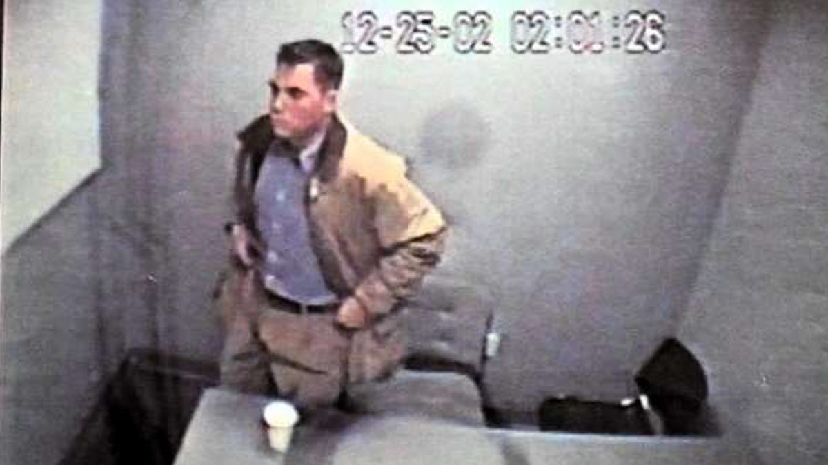 Scott Peterson sitting during police interview in a video still