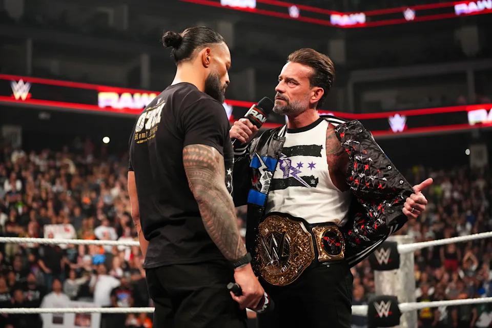 SACRAMENTO, CALIFORNIA - APRIL 13: Roman Reigns and CM Punk face off during Monday Night RAW at Golden 1 Center on April 13, 2026 in Sacramento, California.  (Photo by Rich Freeda/WWE via Getty Images)