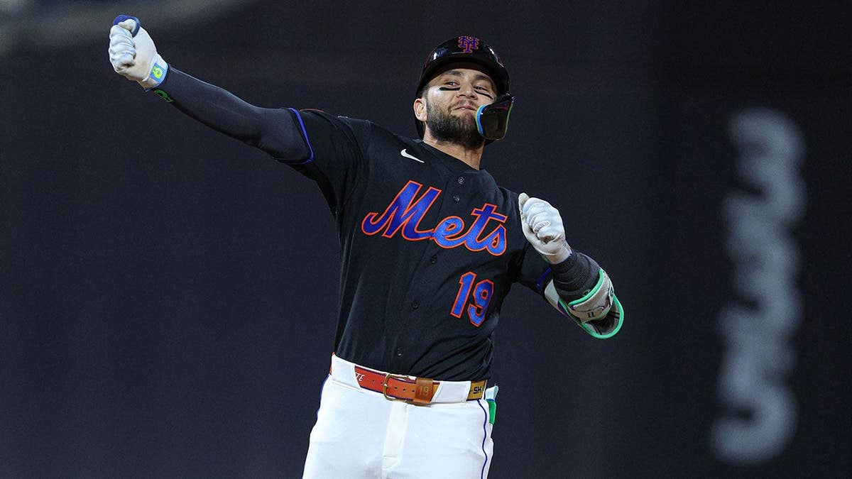 New York Mets shortstop Bo Bichette celebrating after hitting a three-run double at Citi Field
