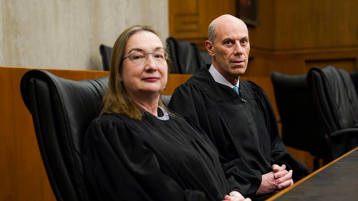 Judge James Boasberg and Judge Beryl Howell posing and talking at E. Barrett Prettyman Federal Courthouse in Washington, D.C.