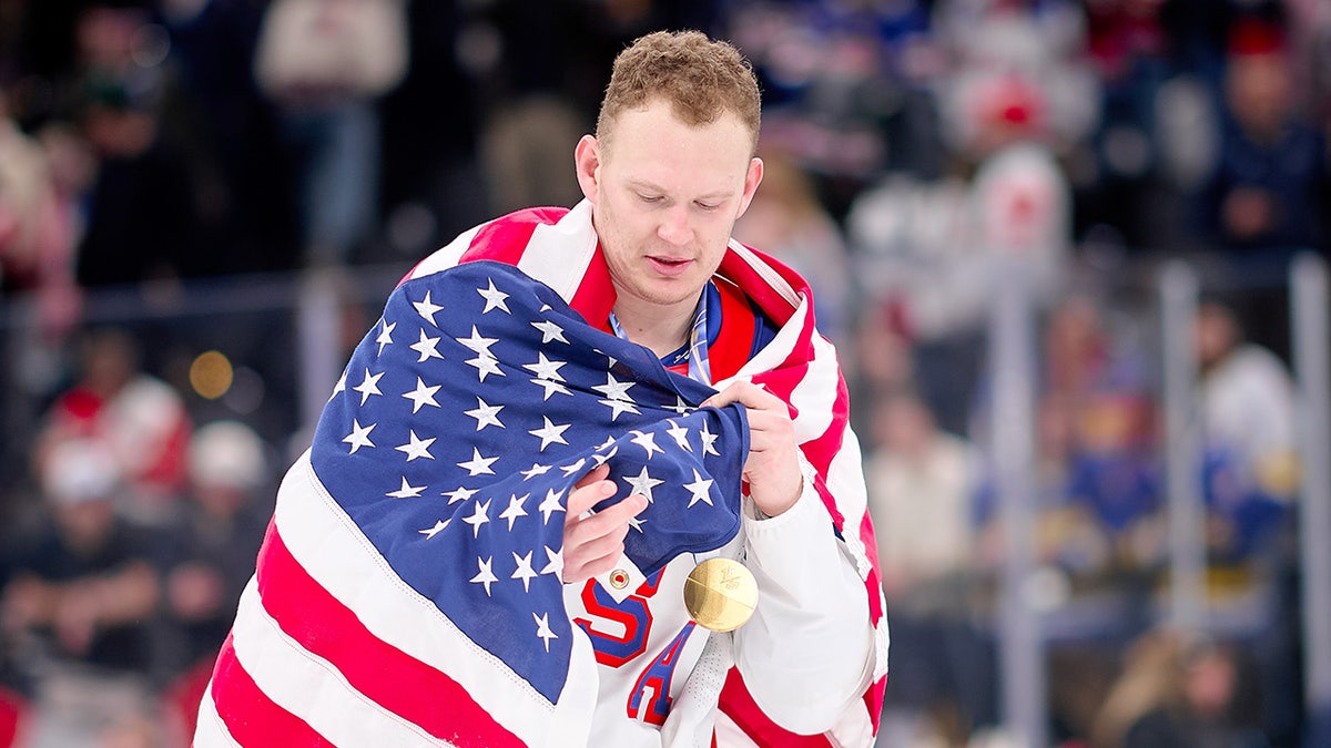 Brady Tkachuk celebrating on ice hockey rink during Olympic gold medal game