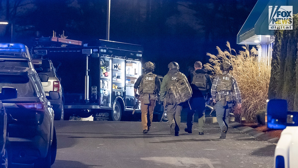 Investigators collecting evidence at the scene where Claudio Manuel Neves-Valente was found dead in Salem, N.H.