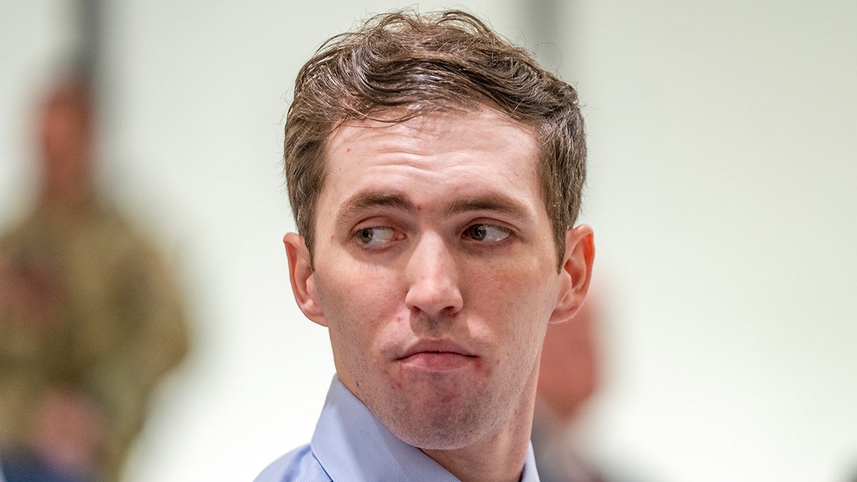 Tyler Robinson standing in a courtroom in Provo, Utah