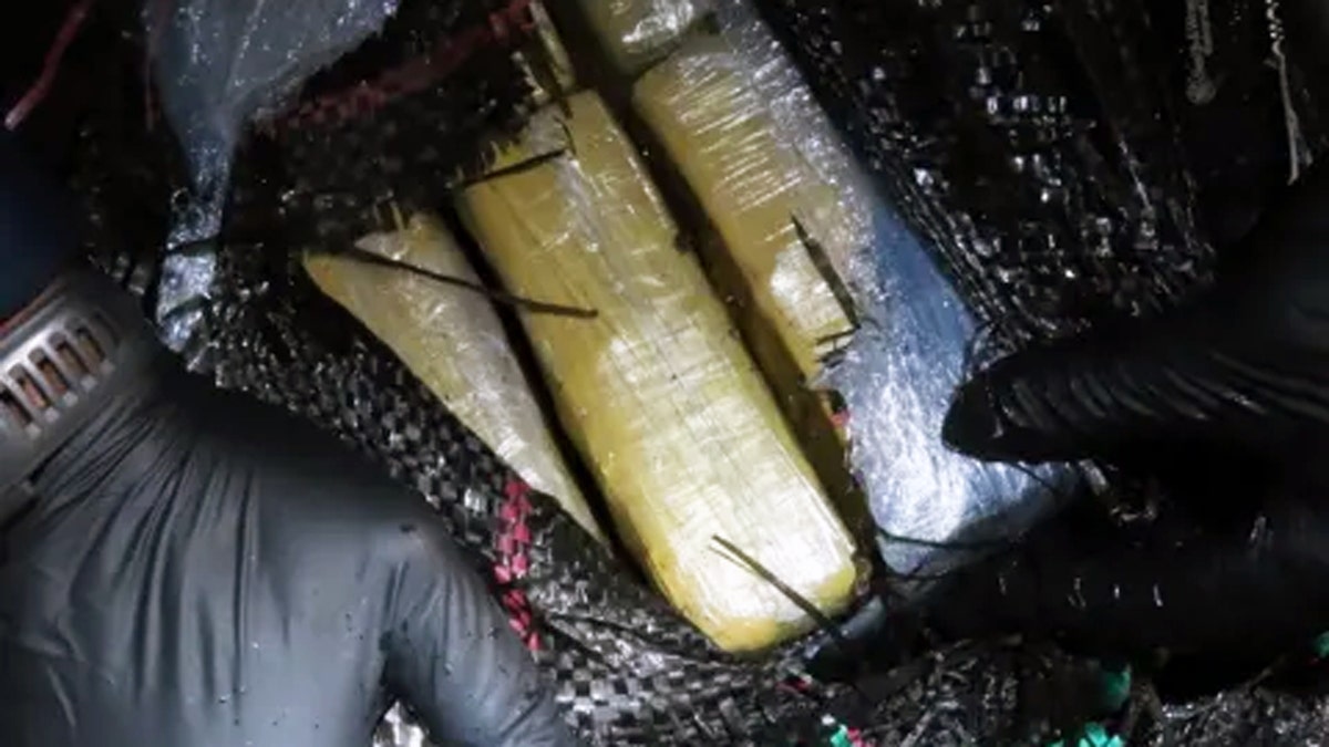 U.S. Coast Guard crews display seized cocaine