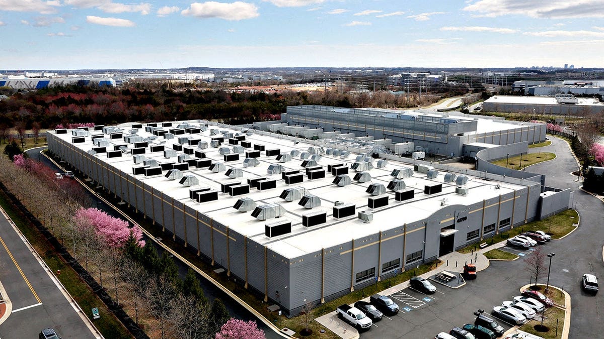 A car driving past the Digital Realty Data Center building in Ashburn, Virginia
