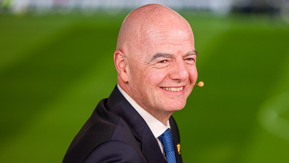 FIFA President Gianni Infantino standing on the sidelines at Banorte Stadium.