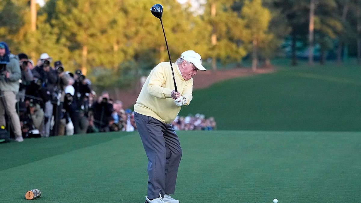 Jack Nicklaus hitting a ceremonial tee shot on the first hole at Augusta National Golf Club