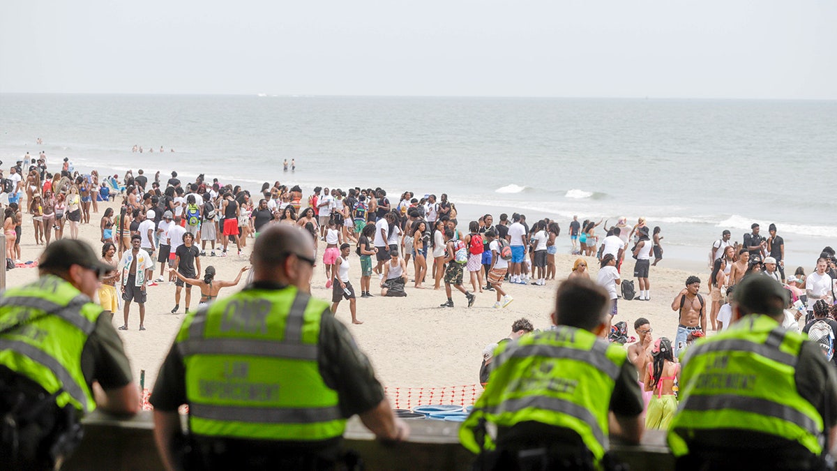 Law enforcement officers keep a watchful eye during Orange Crush