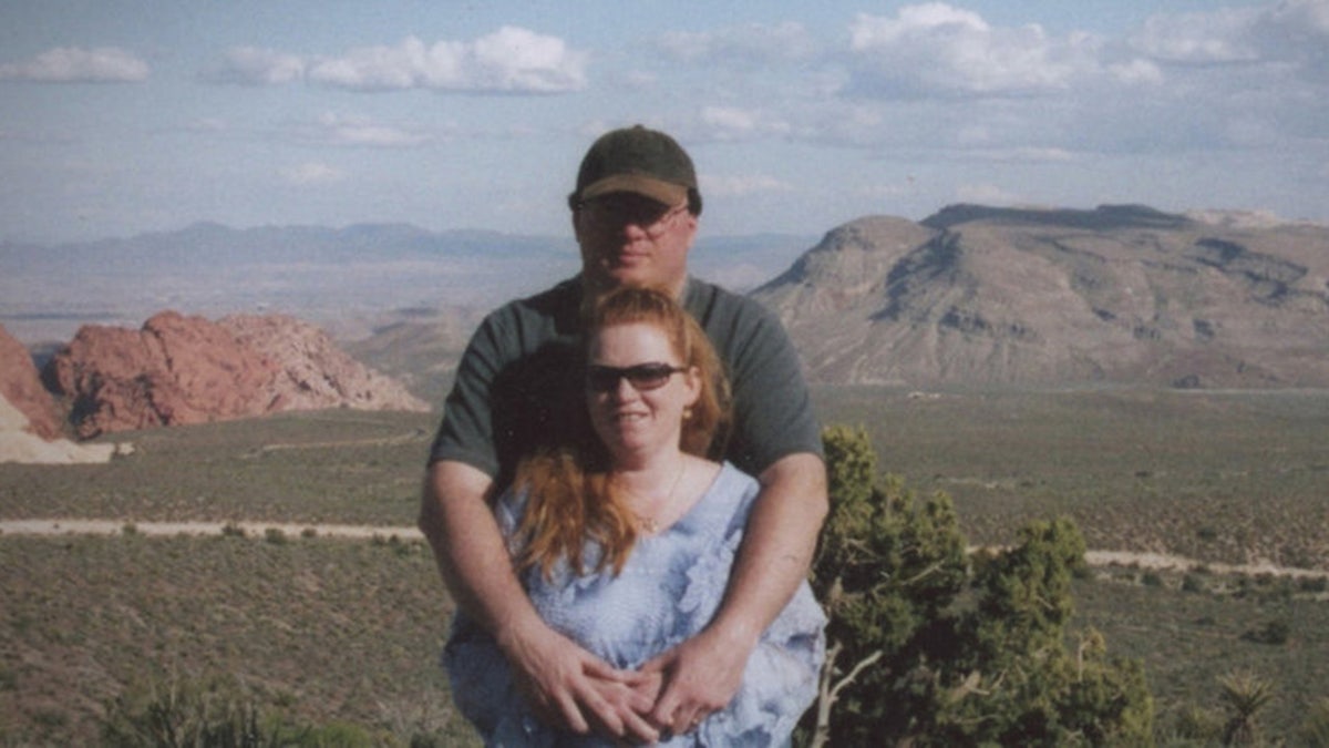 Rex Heuermann with his arms wrapped around Asa Ellerup