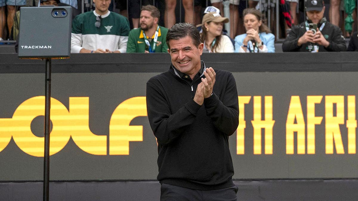 Scott O'Neil and OG Molefe standing on a golf course at The Club at Steyn City