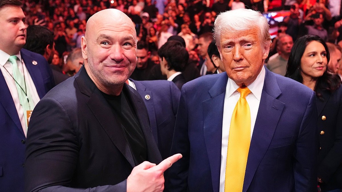 U.S. President Donald Trump talking to UFC President Dana White at Kaseya Center in Miami
