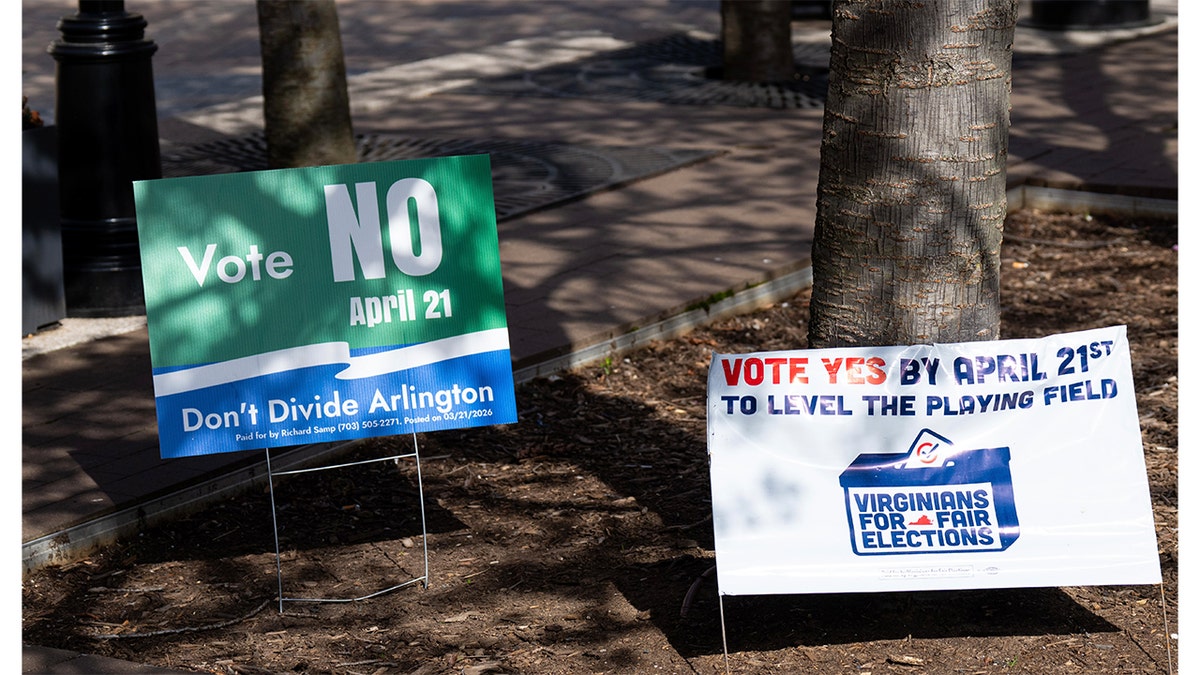 Signs urging early voters to vote yes or no on Virginia redistricting referendum at government center.