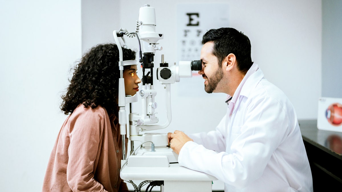 Young woman undergoing optical exam at medical clinic