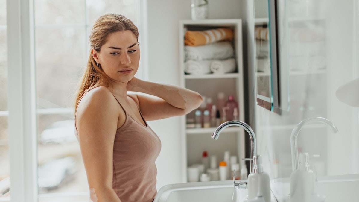 Woman in bathroom painful