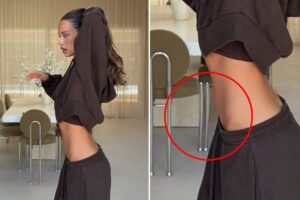 Influencer trashed for apparently manipulating photo to flatten belly — with bizarre result: ‘OMG this is insane’