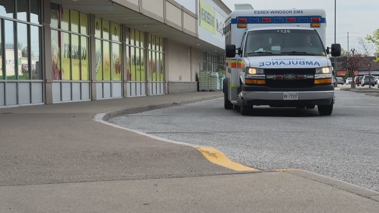 The day after a fatal stabbing in Windsor, Ont., an ambulance pulls by the same area.