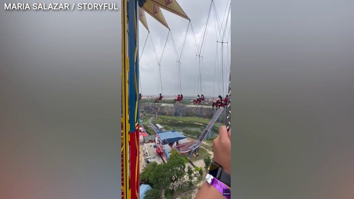 Six Flags riders stranded midair after operator halts 200-foot swing ride