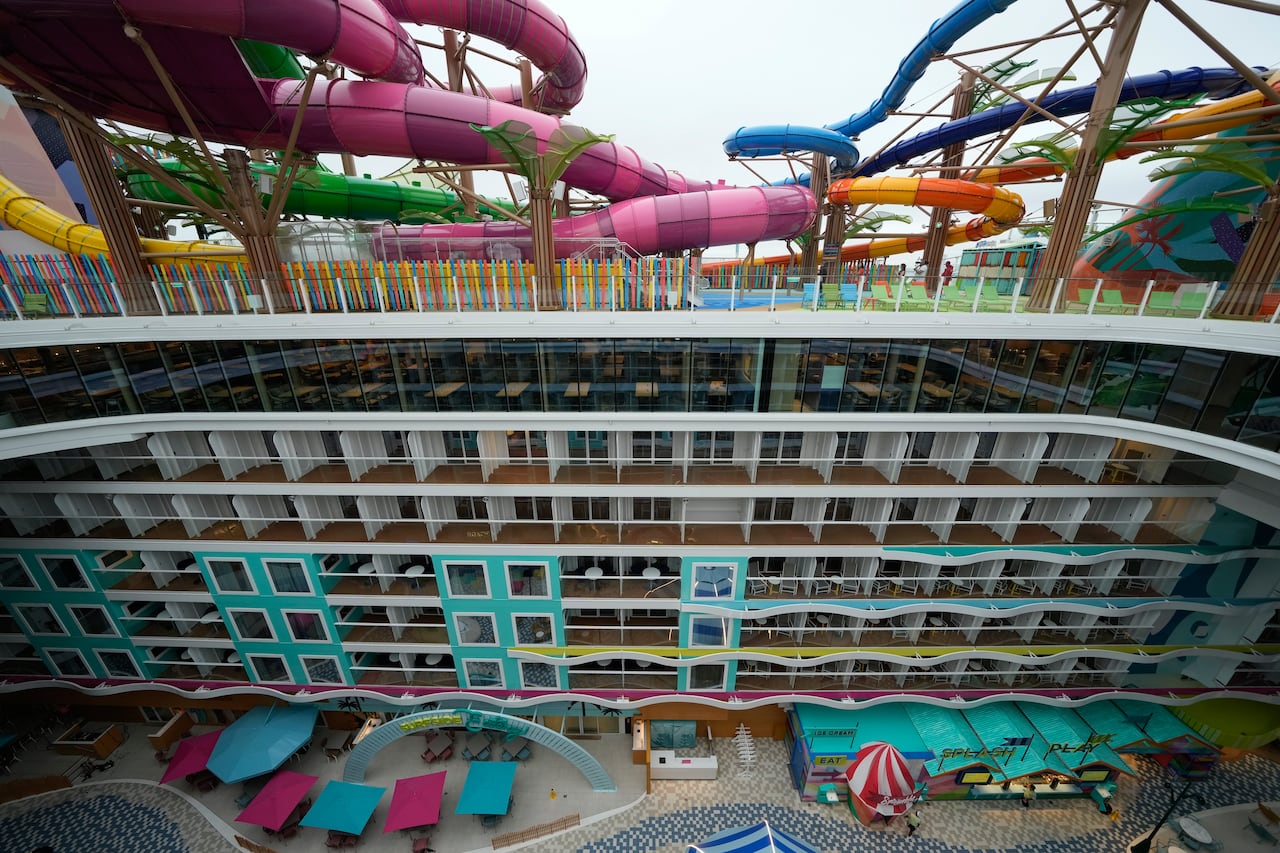 Colourful, twisted waterslides on top of stacks of cabins