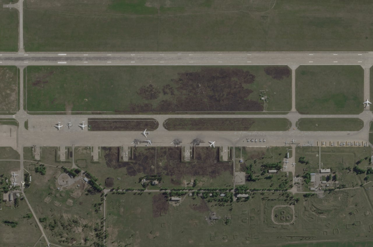 A satellite image of a bombed airfield.