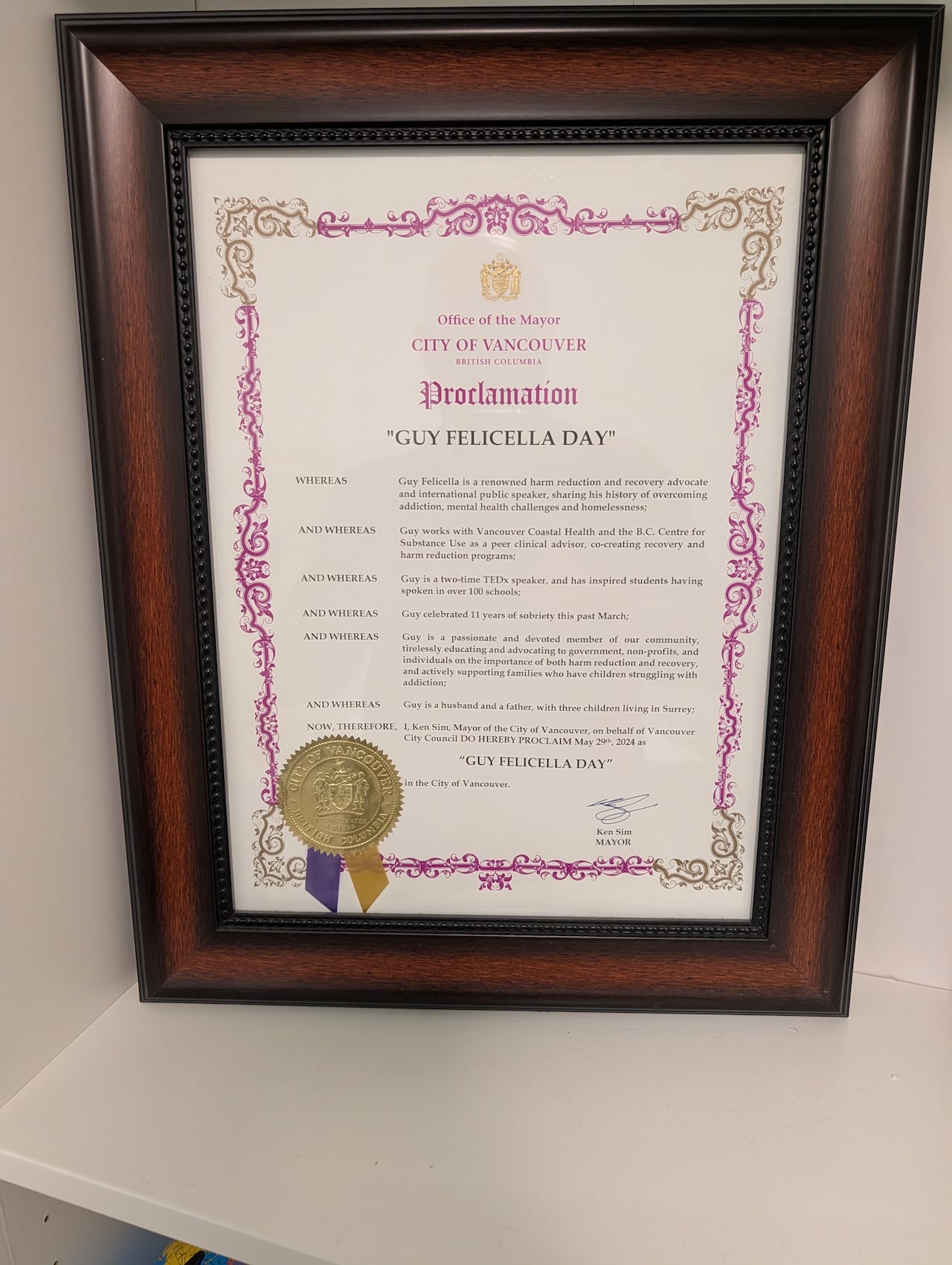 A close up on the mayor's proclamation declaring "Guy Felicella Day."