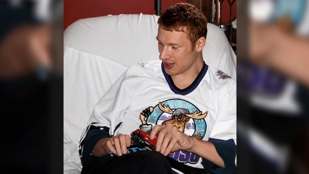A picture of a man wearing a Manitoba Moose jersey.