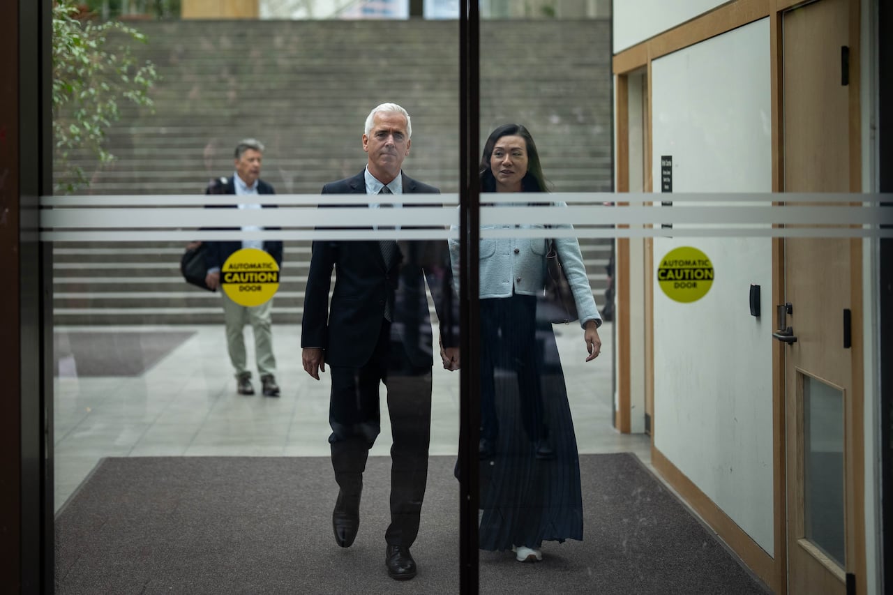 Former RCMP officer William Majcher, left, leaves BC Supreme Court, with his wife Diane, to speak with media after the judge's decision of not guilty of his trial in Vancouver, B.C., on May 13, 2026.