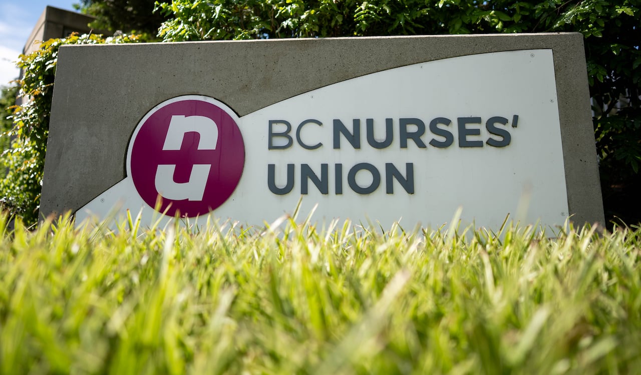 A sign reads 'BC Nurses' Union' on a sunny day.