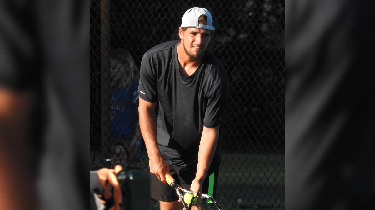 Justin Bourassa playing tennis