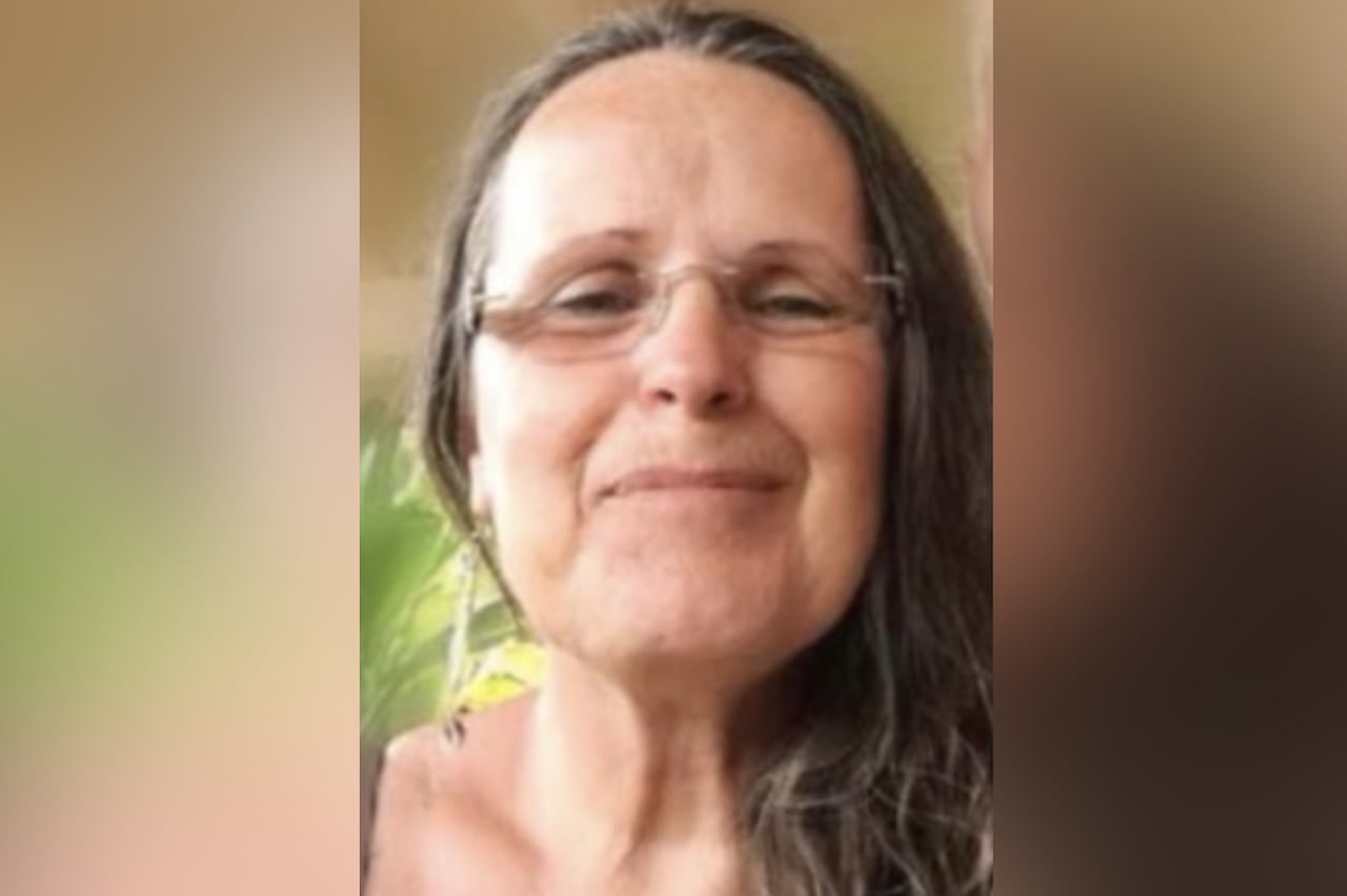 A woman smiles.