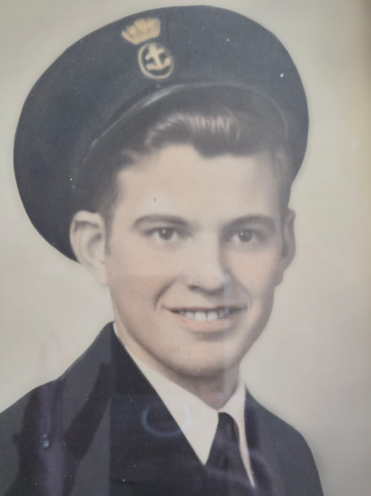 Black and white photo of a young man in uniform.