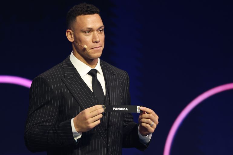 New York Yankees' Aaron Judge displays Panama during the draw for the 2026 soccer World Cup at the Kennedy Center in Washington, Friday, Dec. 5, 2025. (Dan Mullan/Pool Photo via AP)