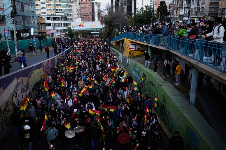People march against protesters blocking the access to the city, in La Paz, Bolivia, Wednesday, May 20, 2026